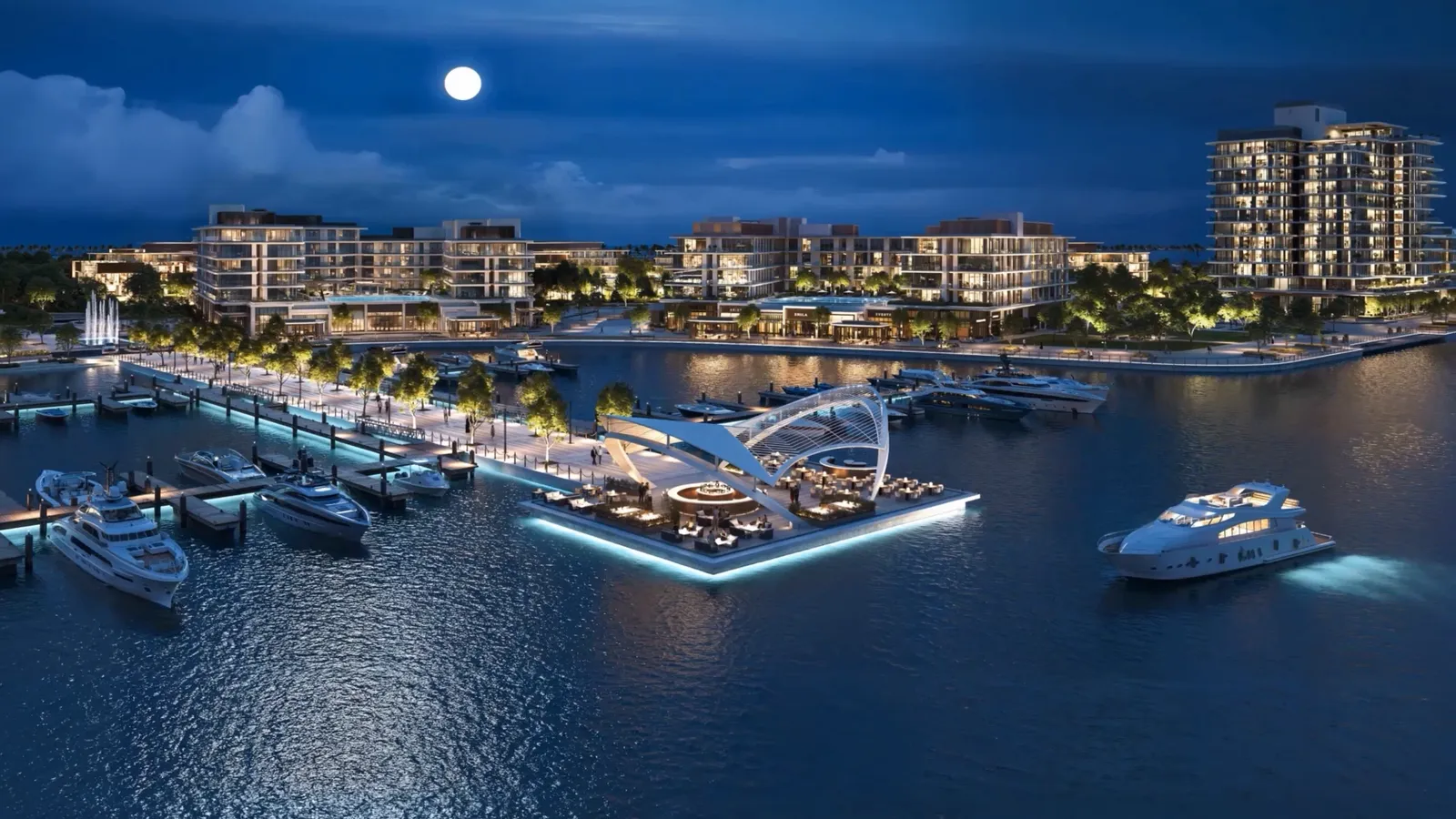 Ramhan Marina at night from the air, with the lit pavilion, berths and yachts, frame from Eagle Hills' Ramhan Marina film